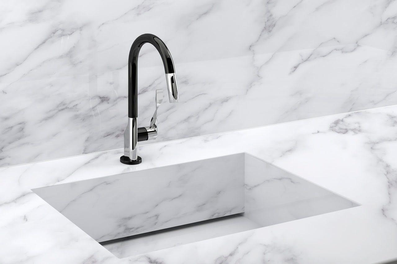 A modern kitchen sink with a sleek black faucet set in a marble countertop and backsplash.