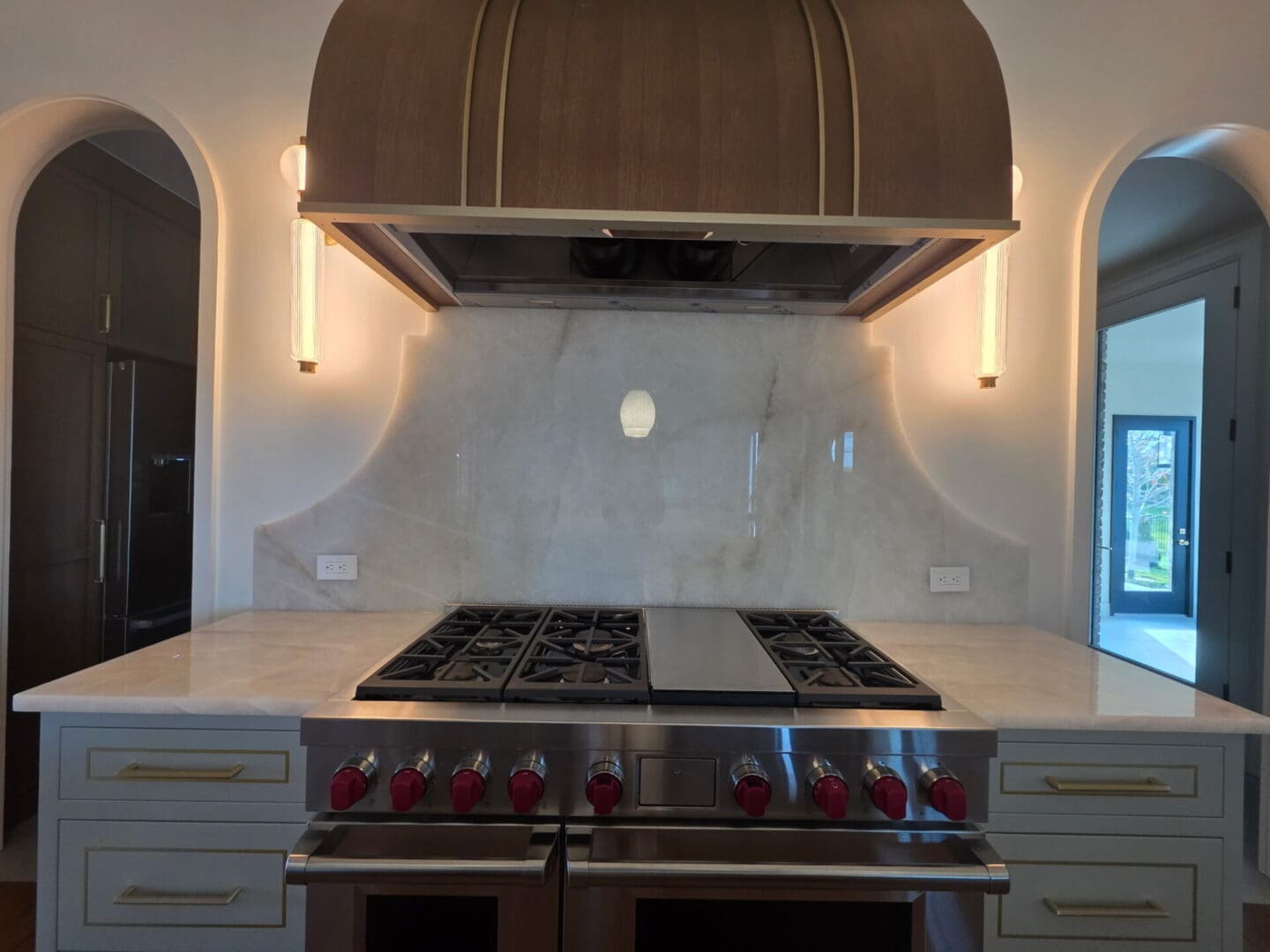 Gourmet gas range with marble backsplash