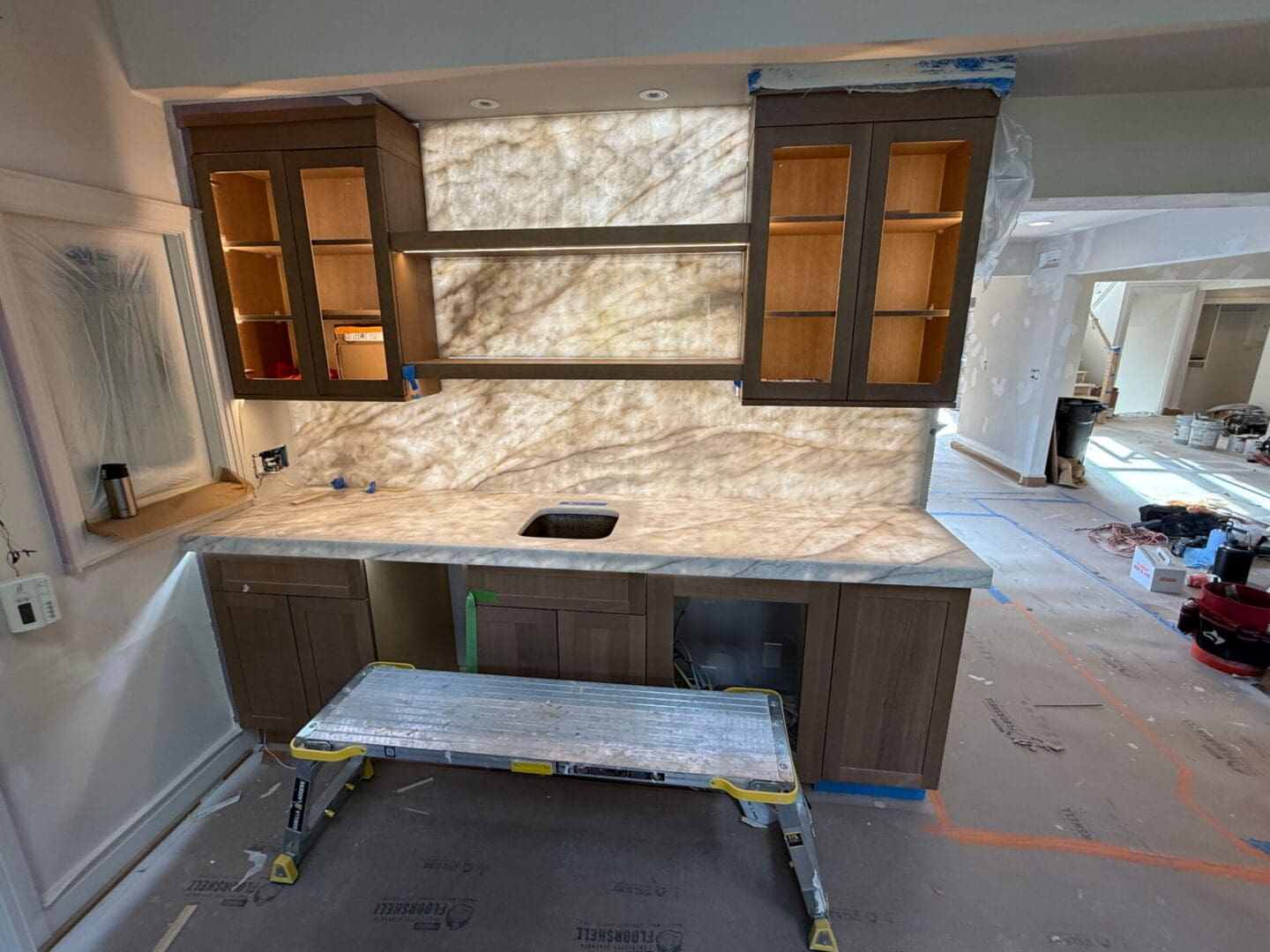Backlit stone backsplash in kitchen renovation