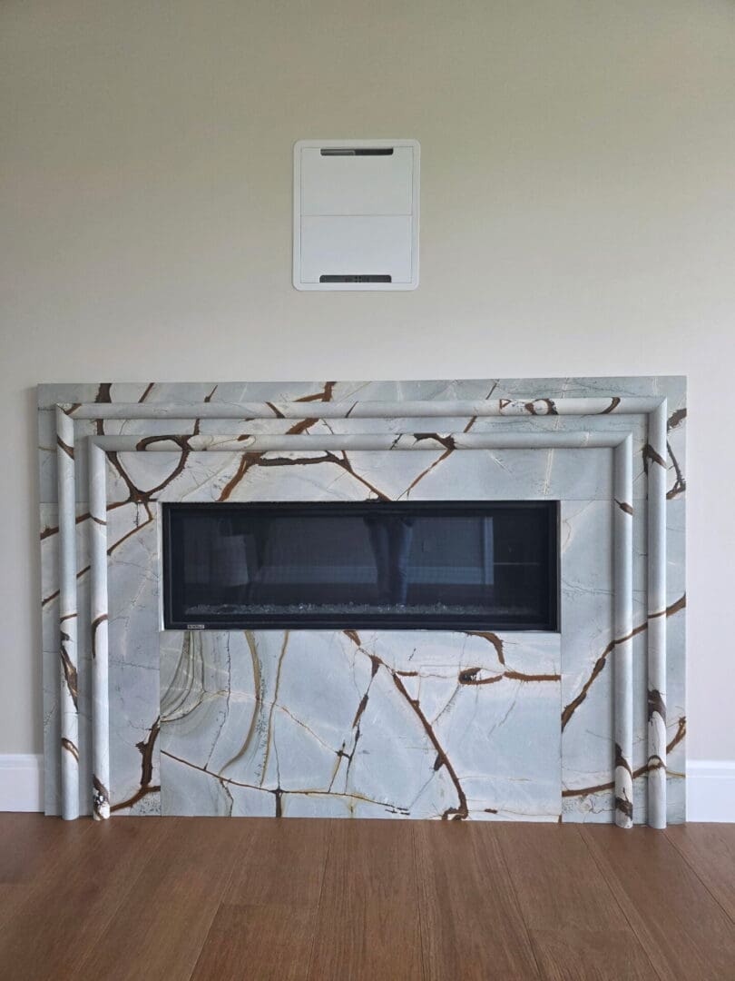 Marble fireplace surround with rectangular black insert