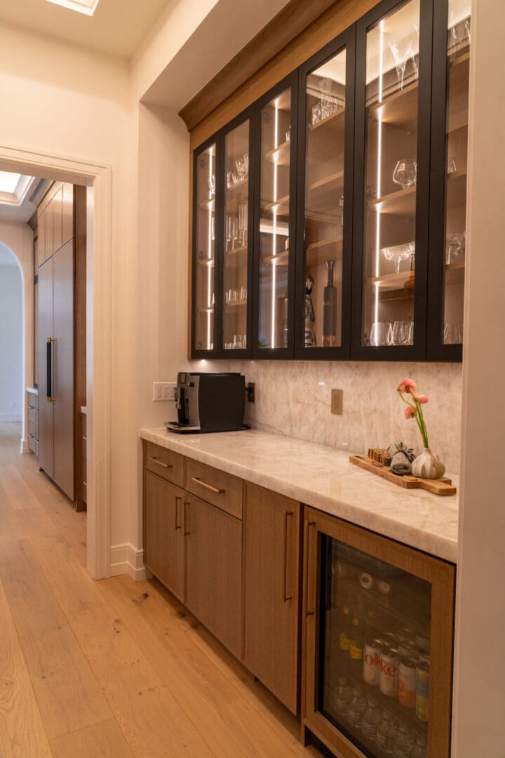 Butler's pantry with marble counter and fridge