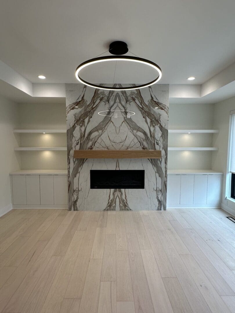 Contemporary living room with marble fireplace wall